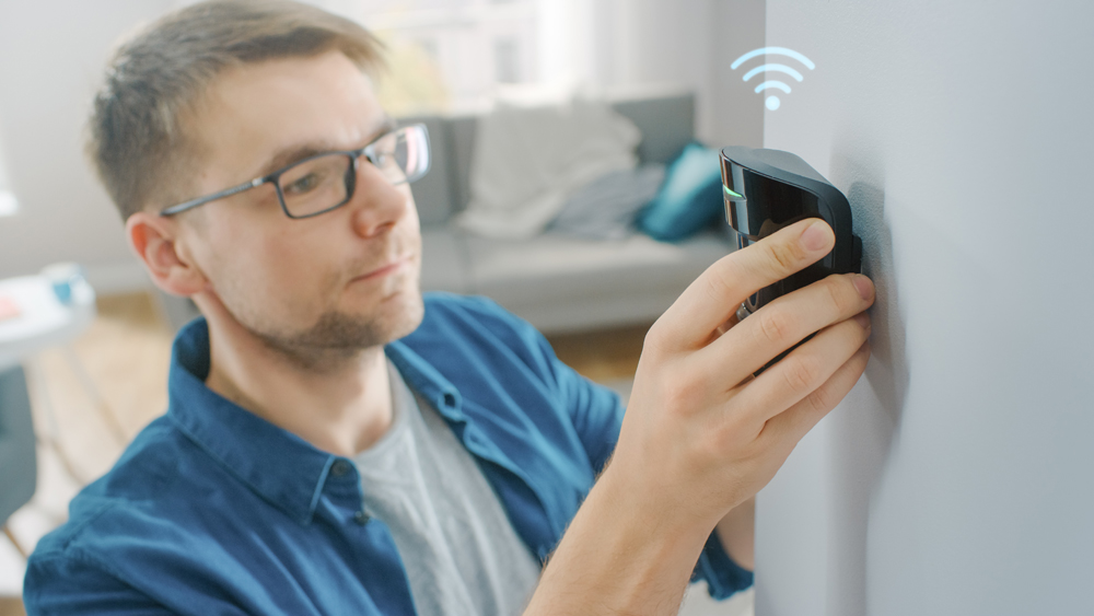 Young,Man,In,Glasses,Wearing,A,Blue,Shirt,Is,Hanging